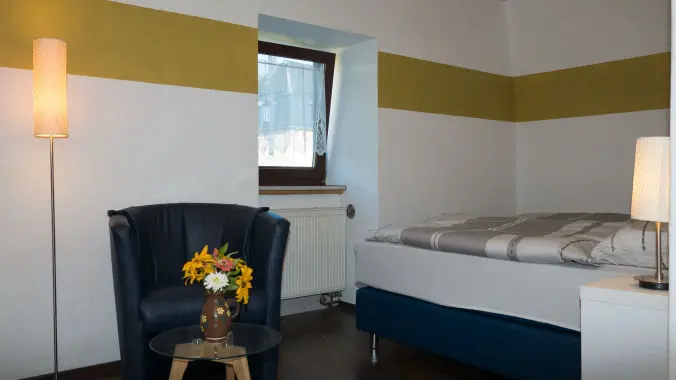 Schlafzimmer Ferienwohnung  zentrale Lage am Kurmittelhaus Actinon Haus Ilse Schlafzimmer Ferienwohnung Bad Schlema
